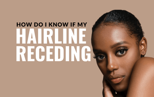 A woman examining her hairline, looking concerned