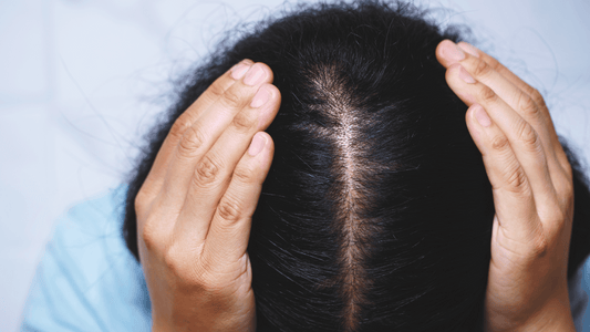 African American girl holding her hair