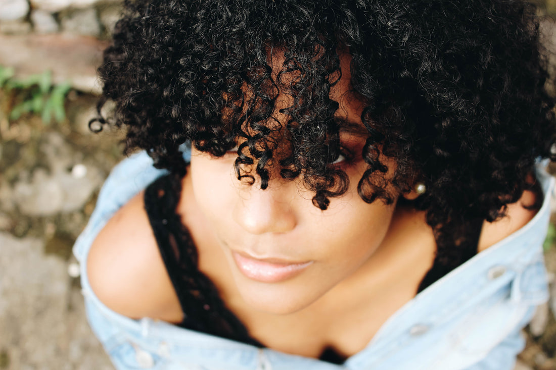 Woman with black curly hair