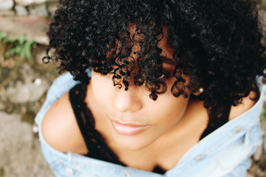 Woman with black curly hair