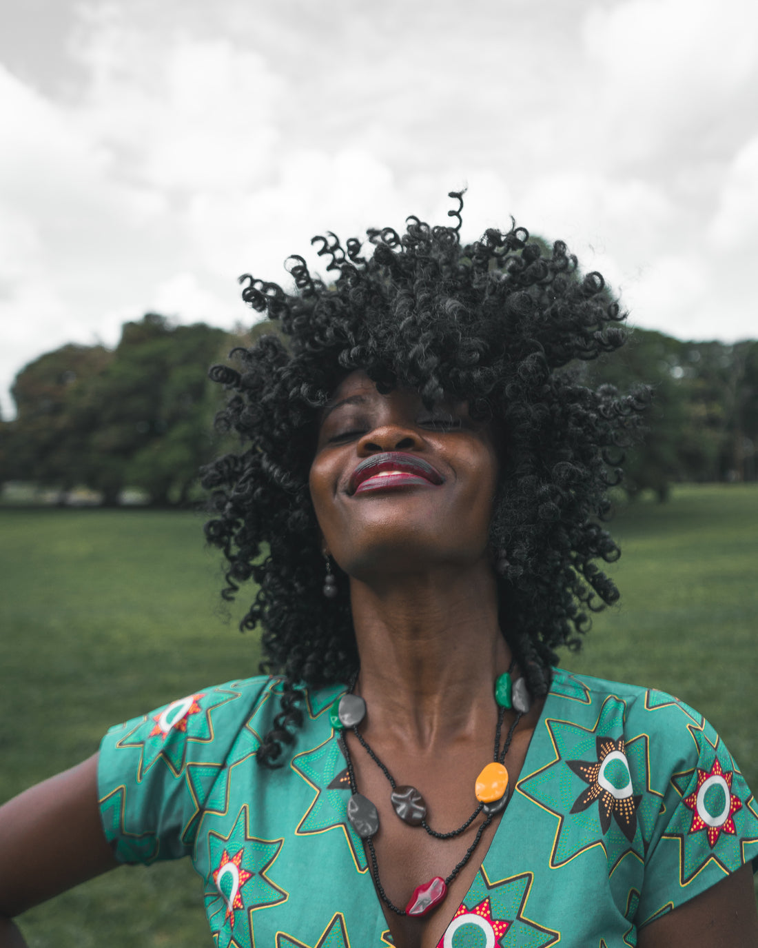 Woman in green shirt smiling